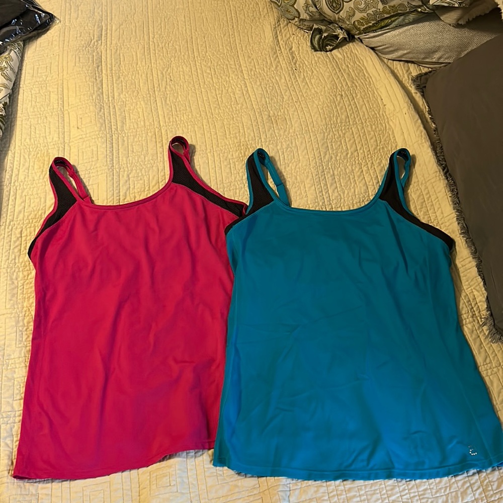Women’s size medium sports tank tops with lining. Worn. No stains/tears.